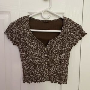 Top from Brandy Melville, one size and it is brown with white flowers.